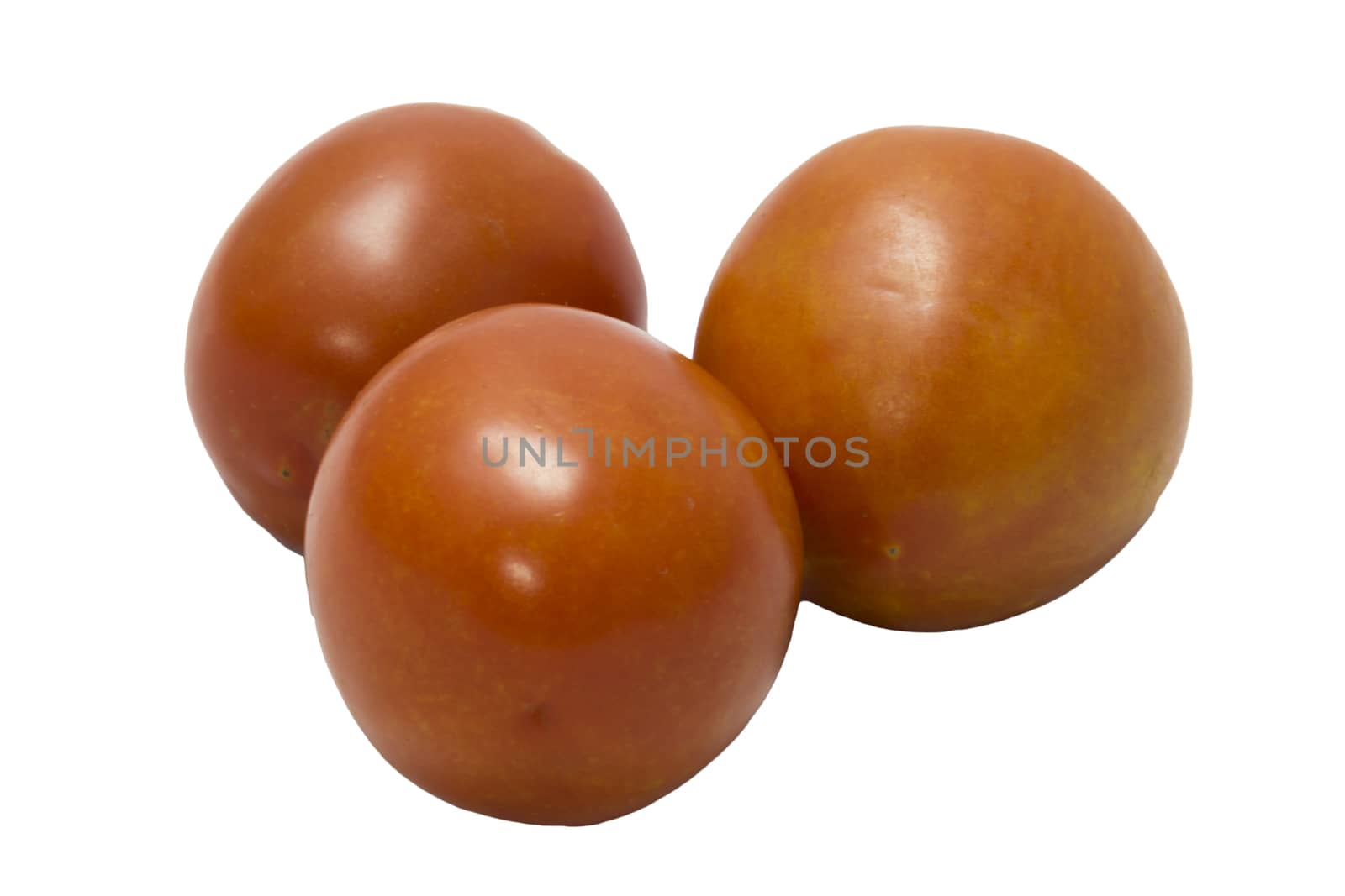 three fresh tomatoes with green leaves isolated on white background