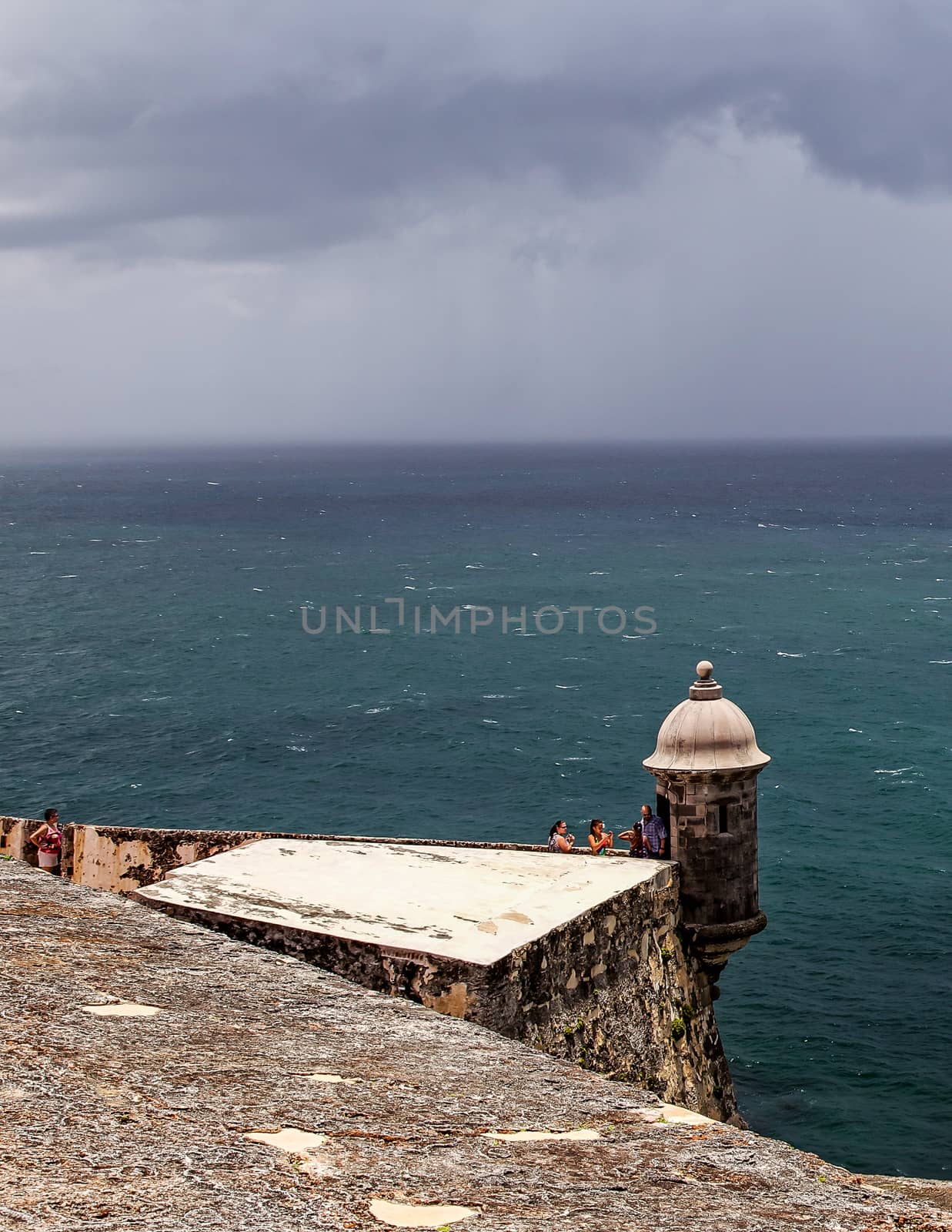 San Juan, Puerto Rico- June 15, 2013: Tourists explore the guardhouses at Castillo San Felipe del Morro, an old Spanish fort.