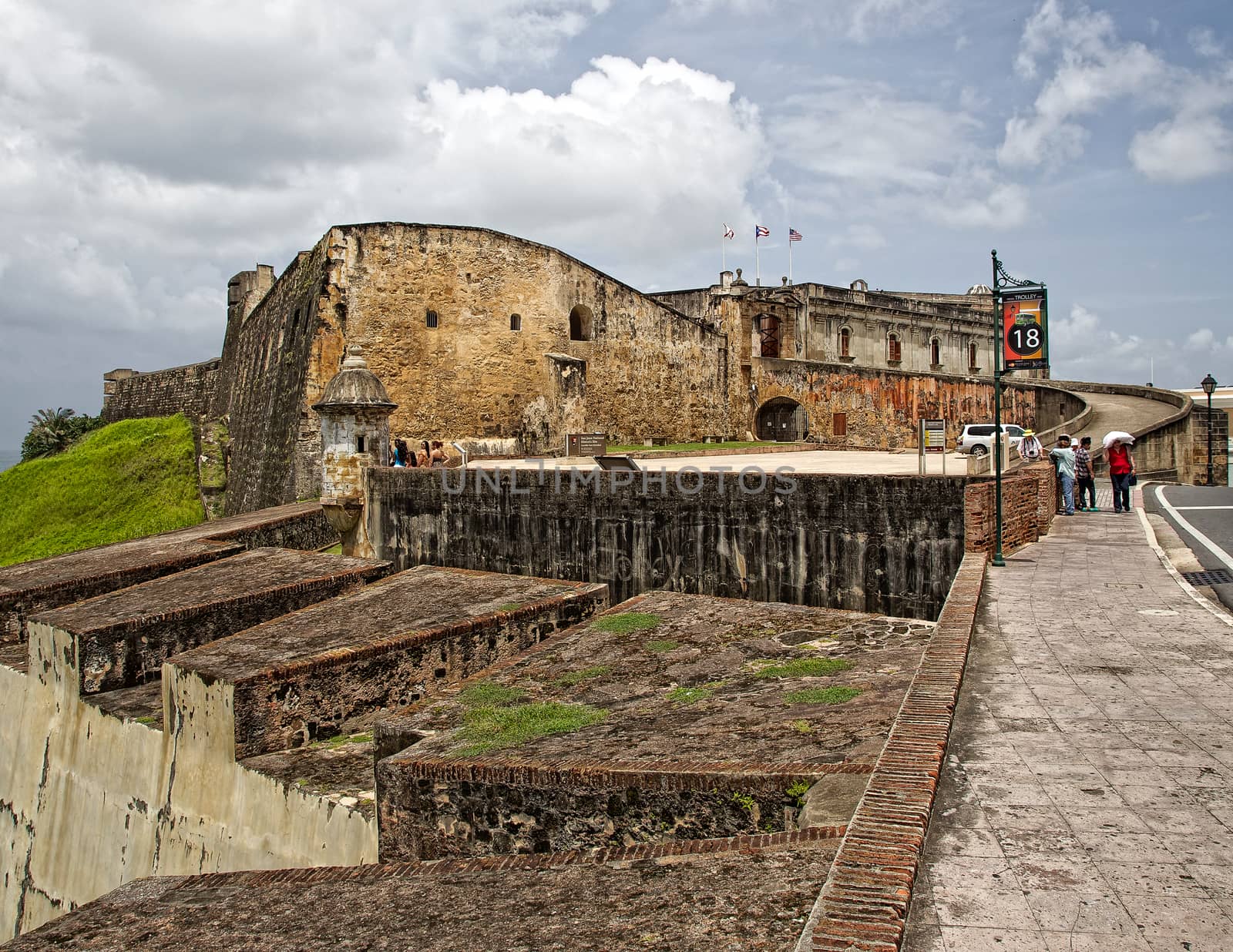 San Juan, Puerto Rico- June 15, 2013: Tourists explore the fort Castillo de San Cristóbal in Old San Juan.