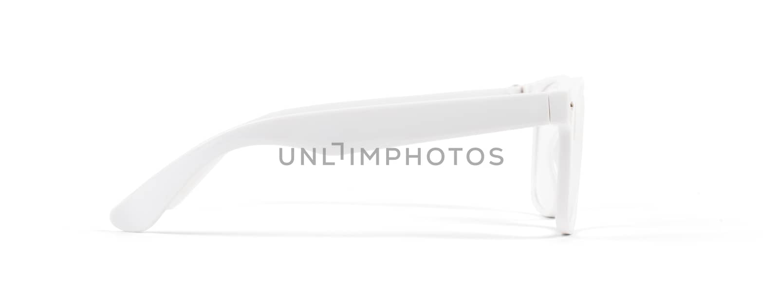 Pair of white eyeglasses isolated on white background, side view