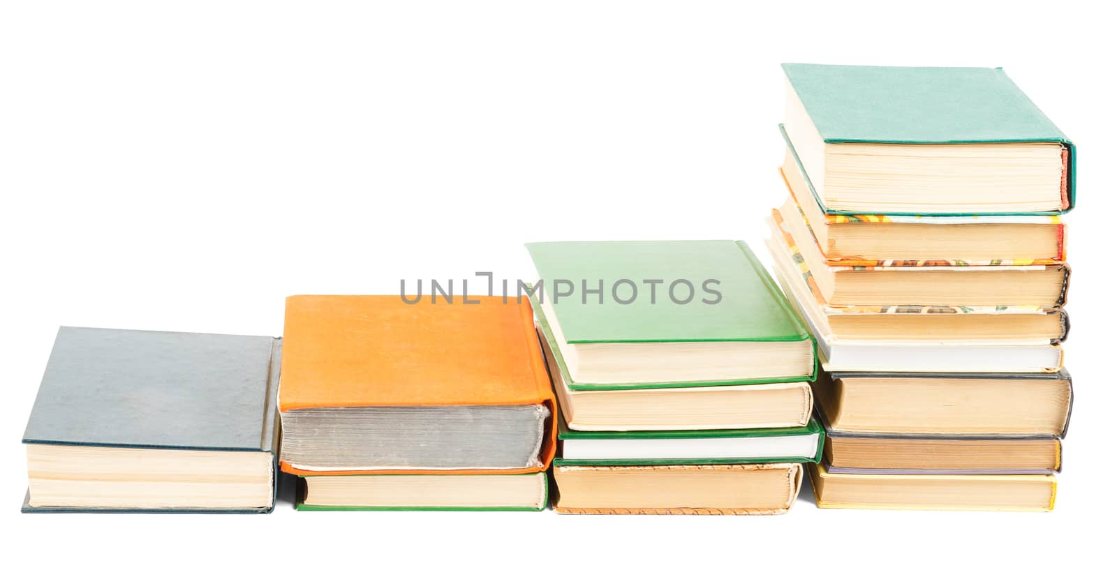 Stacks of books isolated on white background, closeup