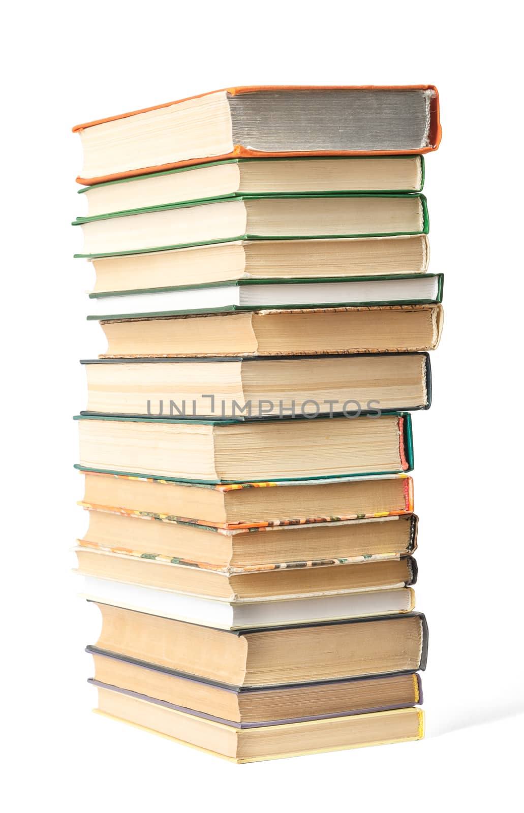 Pile of books isolated on white background, side view