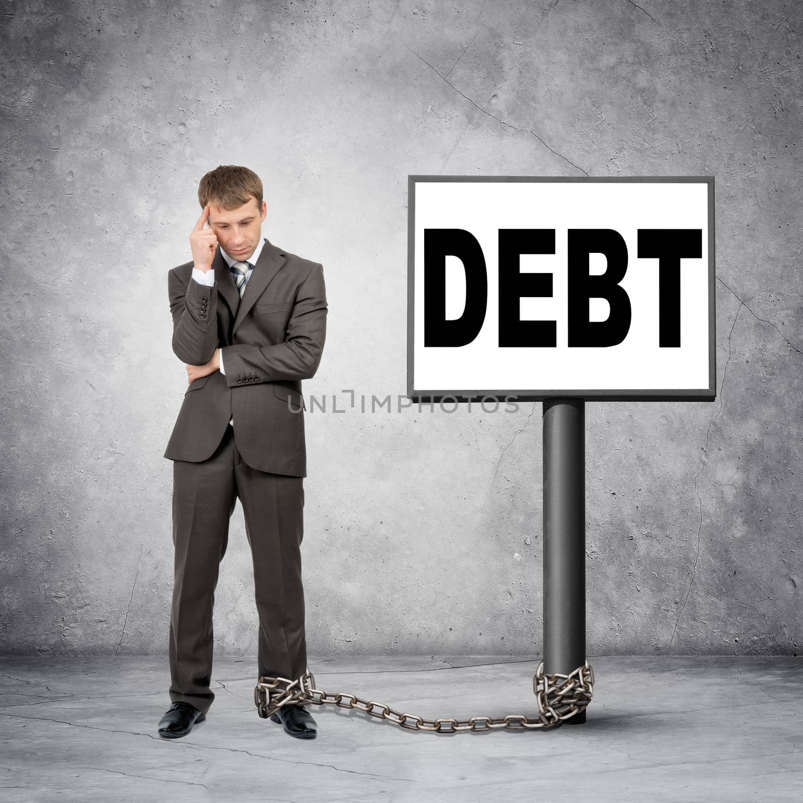 Businessman word debt on post sign by cherezoff