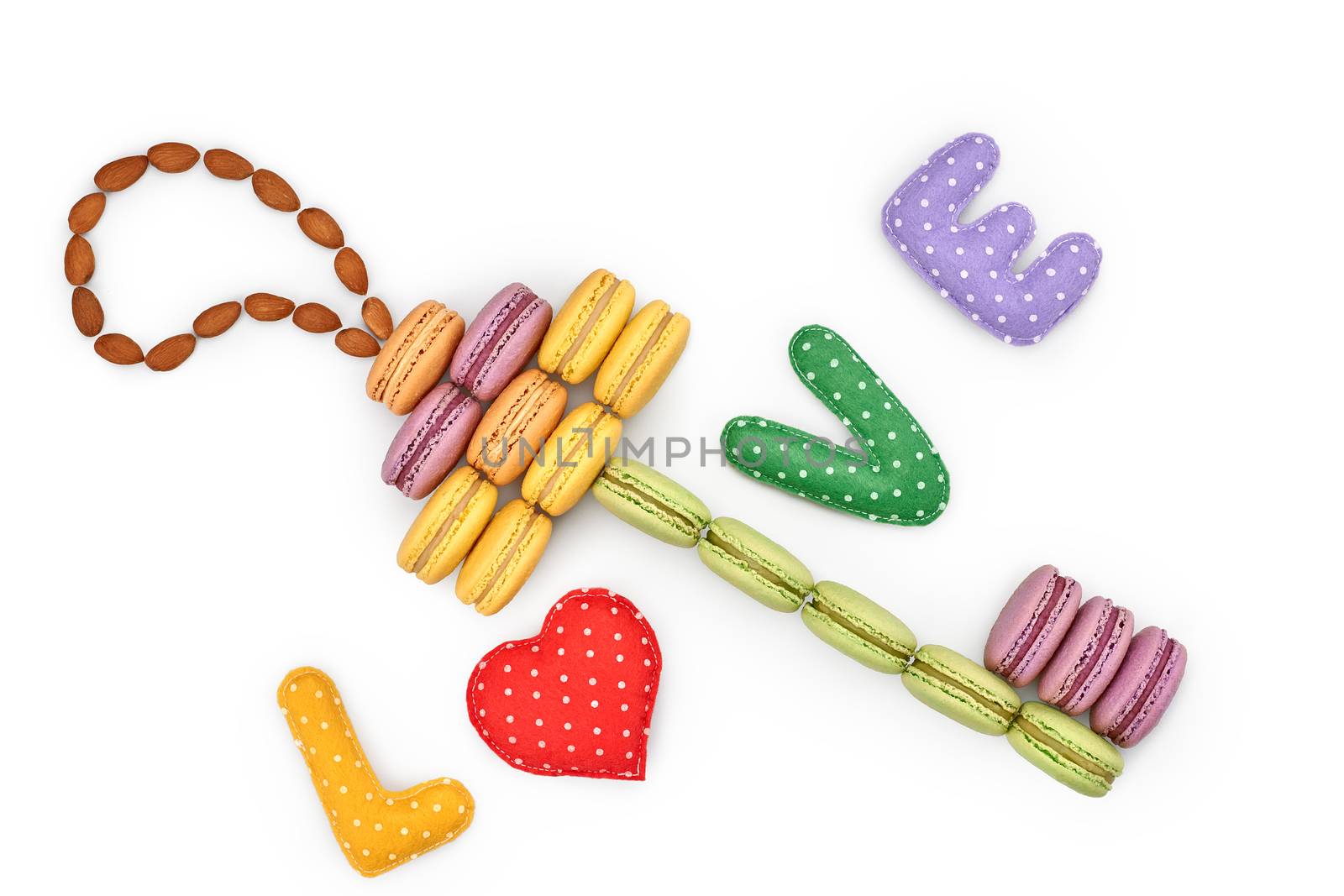 Macarons sweet colorful, key shape. Word Love handmade, heart. French traditional delicious dessert, almond. Unusual creative romantic still life. Concept for love story. Valentines Day. Isolated