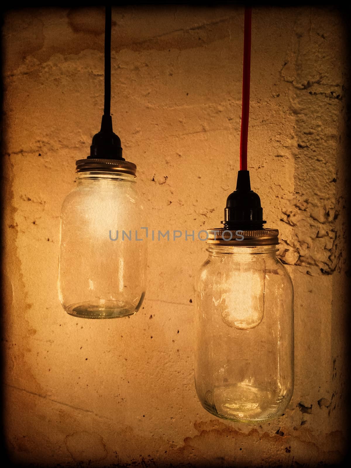 Vintage style pendant lights on dark grunge background.