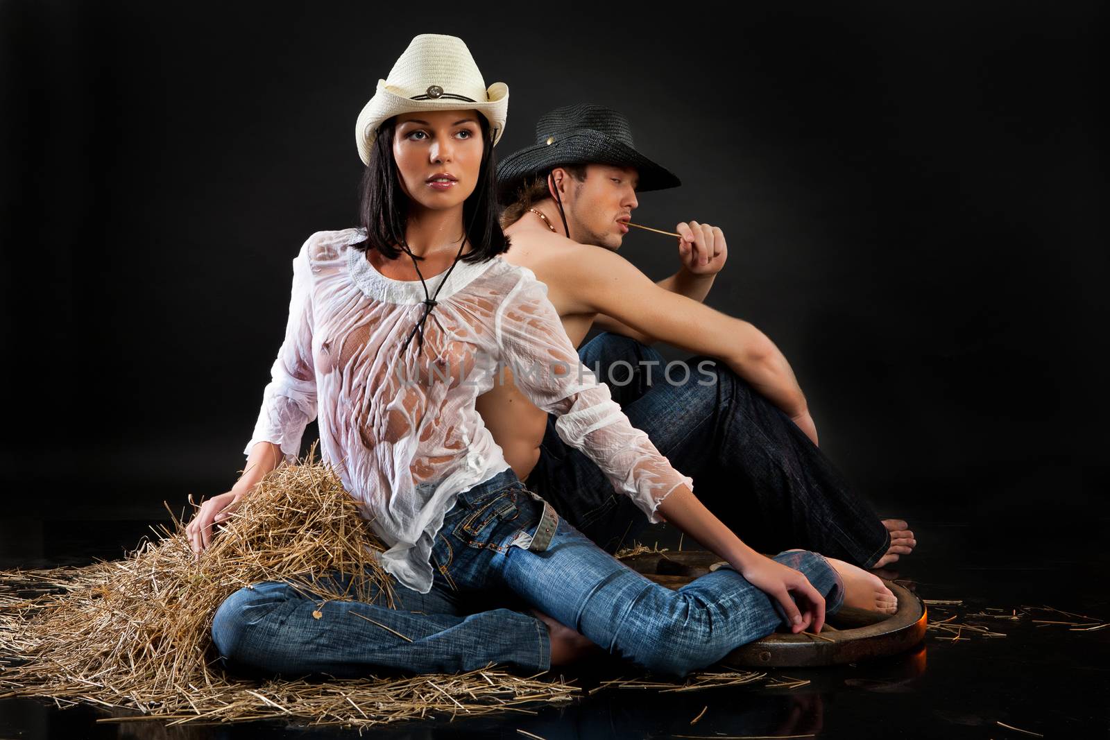 Young beautiful woman and man dressed in western style