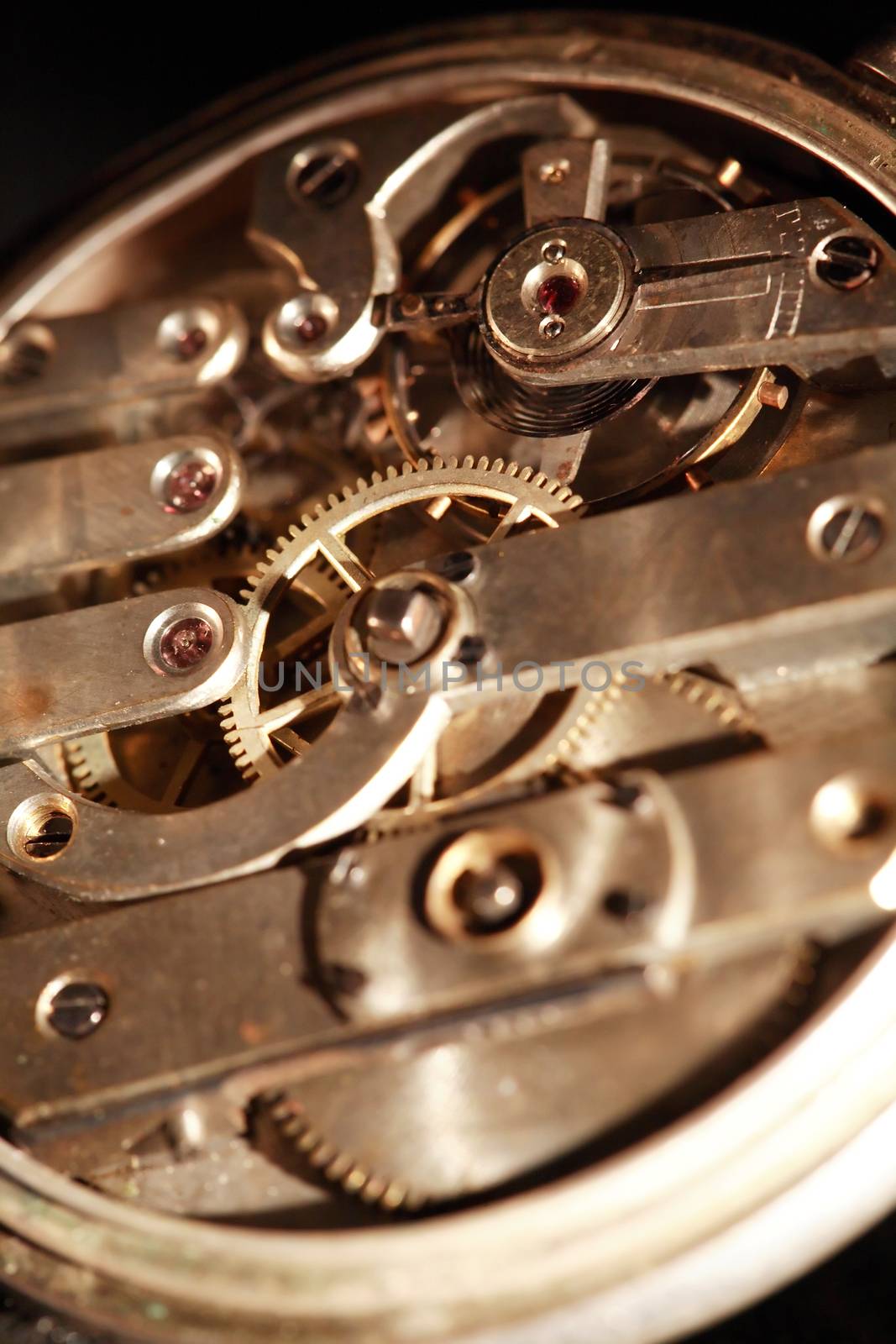 Industrial concept. Closeup of old pocket watch mechanism