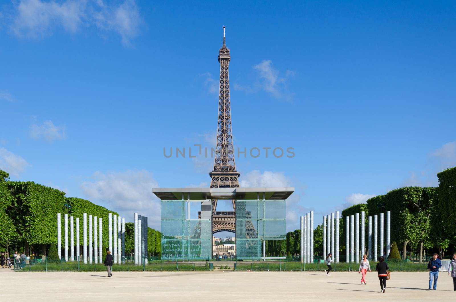 Paris, France - May 15, 2015: People visit The Wall for Peace on the Champs de Mars, at the foot of the Eiffel Tower in Paris. The Wall for Peace is freely inspired by the Wailing Wall of Jerusalem.