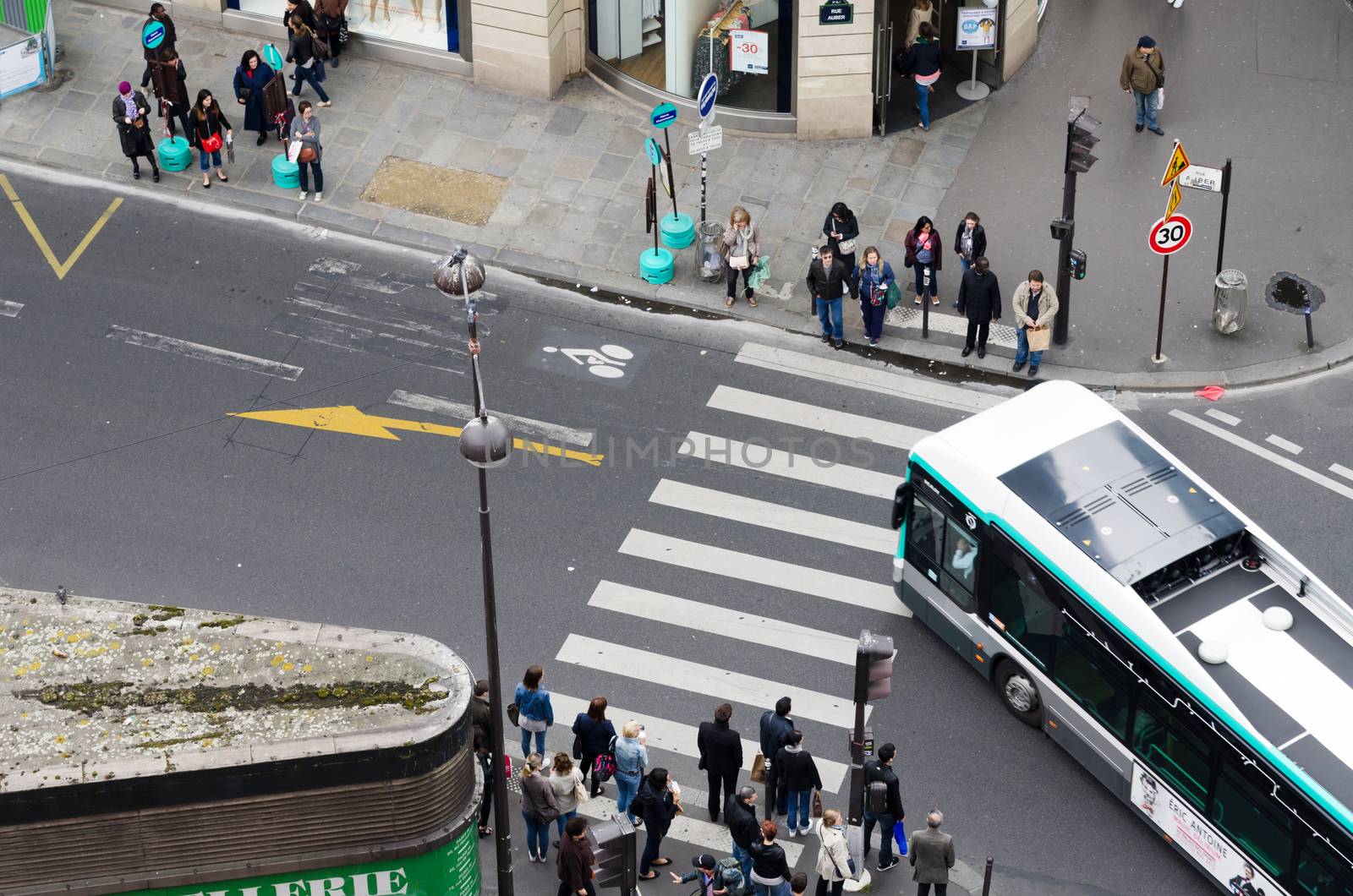 Paris, France - May 15, 2015: People on the street near Madelein Church in Paris by siraanamwong