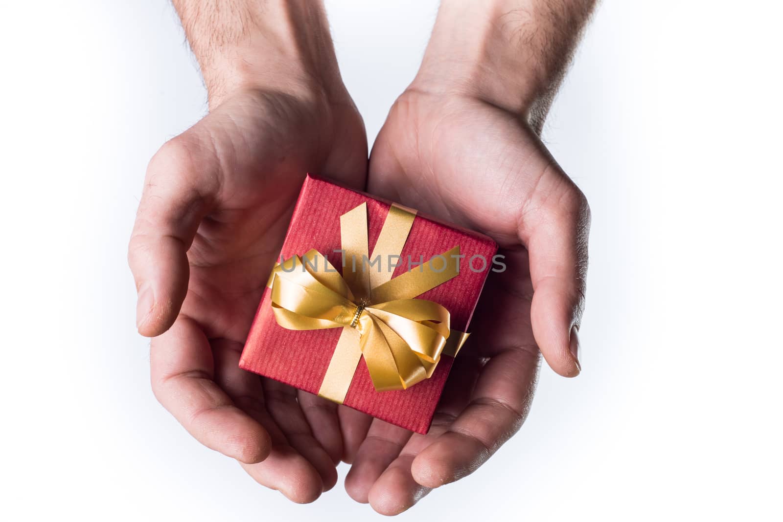 Concept hands giving gift on white background