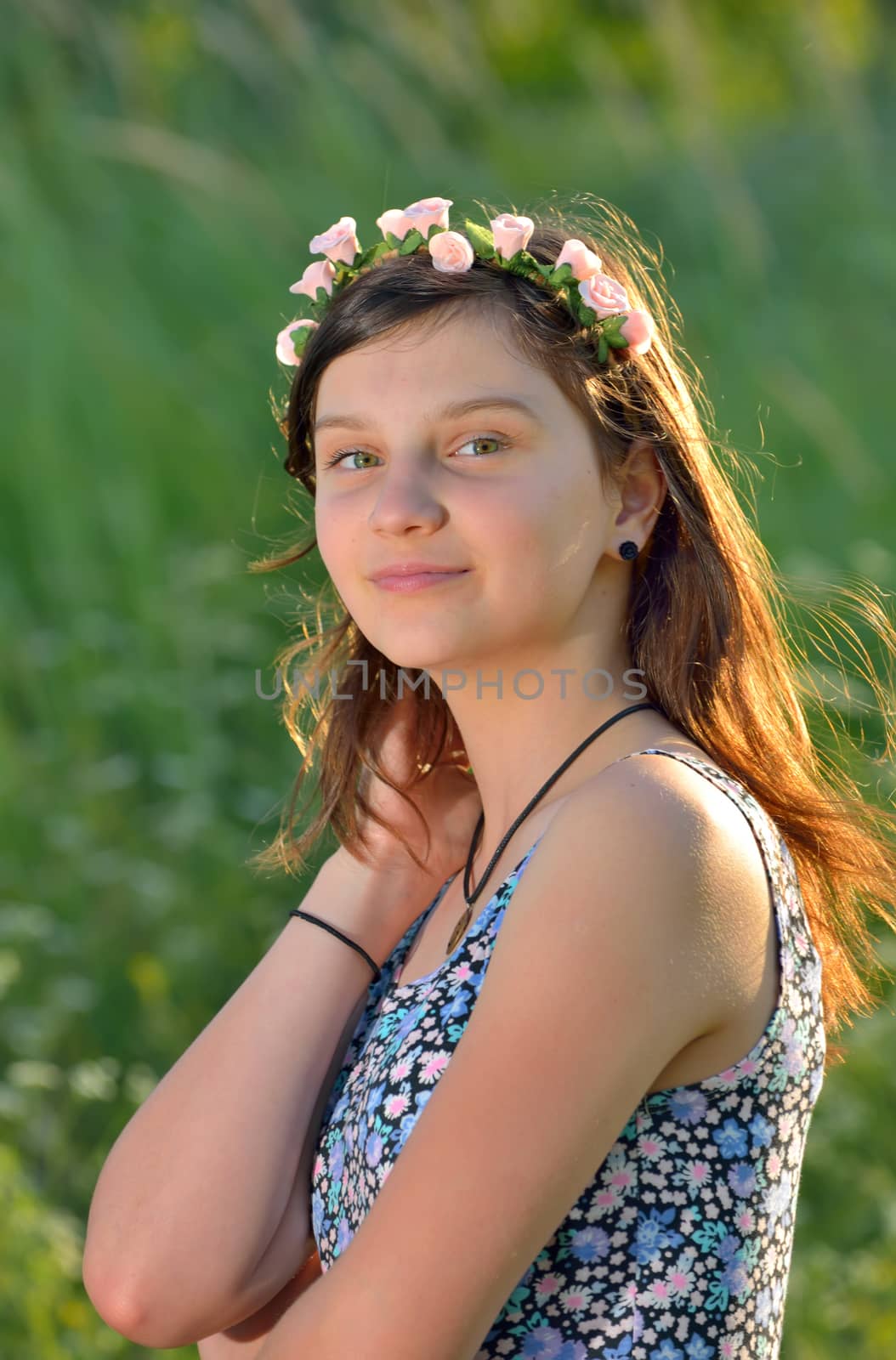 teen girl with wreath in summer time