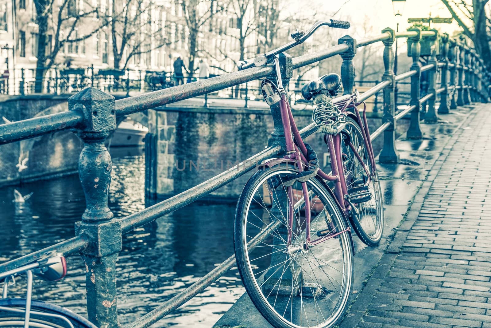 Amsterdam canal and bicycles by gianliguori