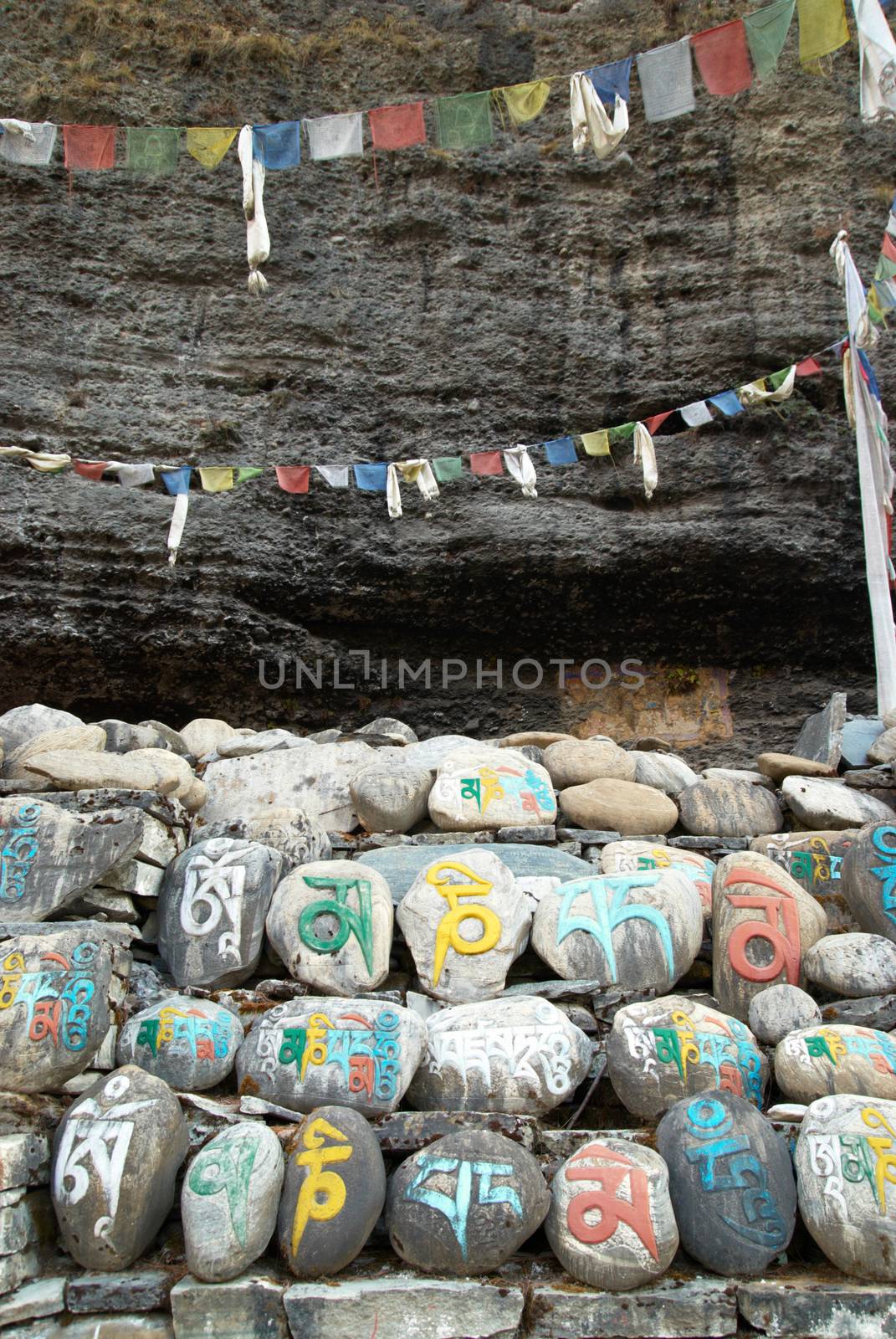 Tibetan colorful prayer stones with letters. Nepal.