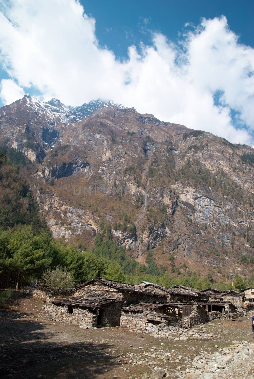 Tibetan village in Himalayan mountain with blue sky.