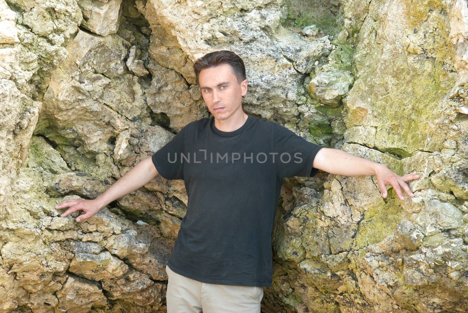 Young man near the rocks by vapi