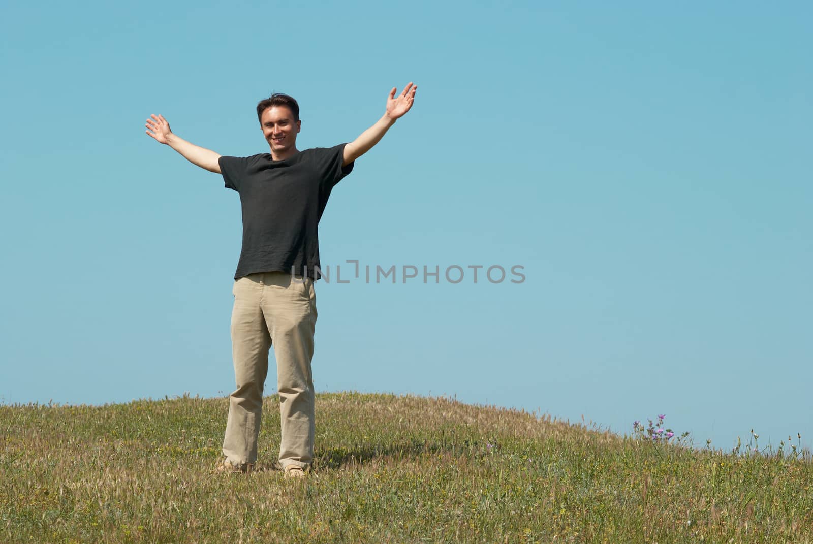 Young man on the grass field by vapi