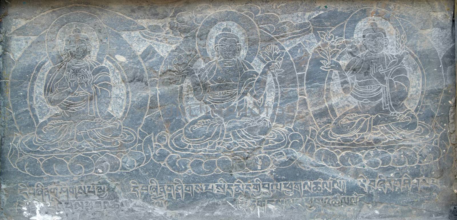 The buddhistic pictures engraved on the stone