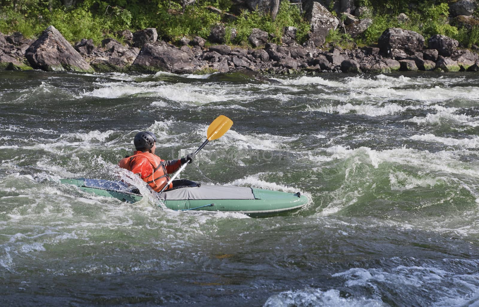Kayaker in whitewater by Goodday