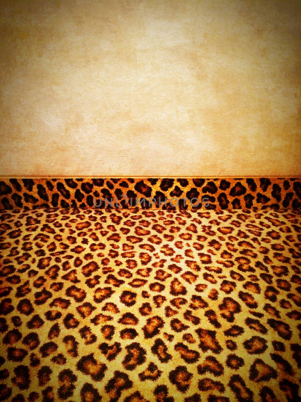 Retro background. Leopard carpet and grungy old wall.