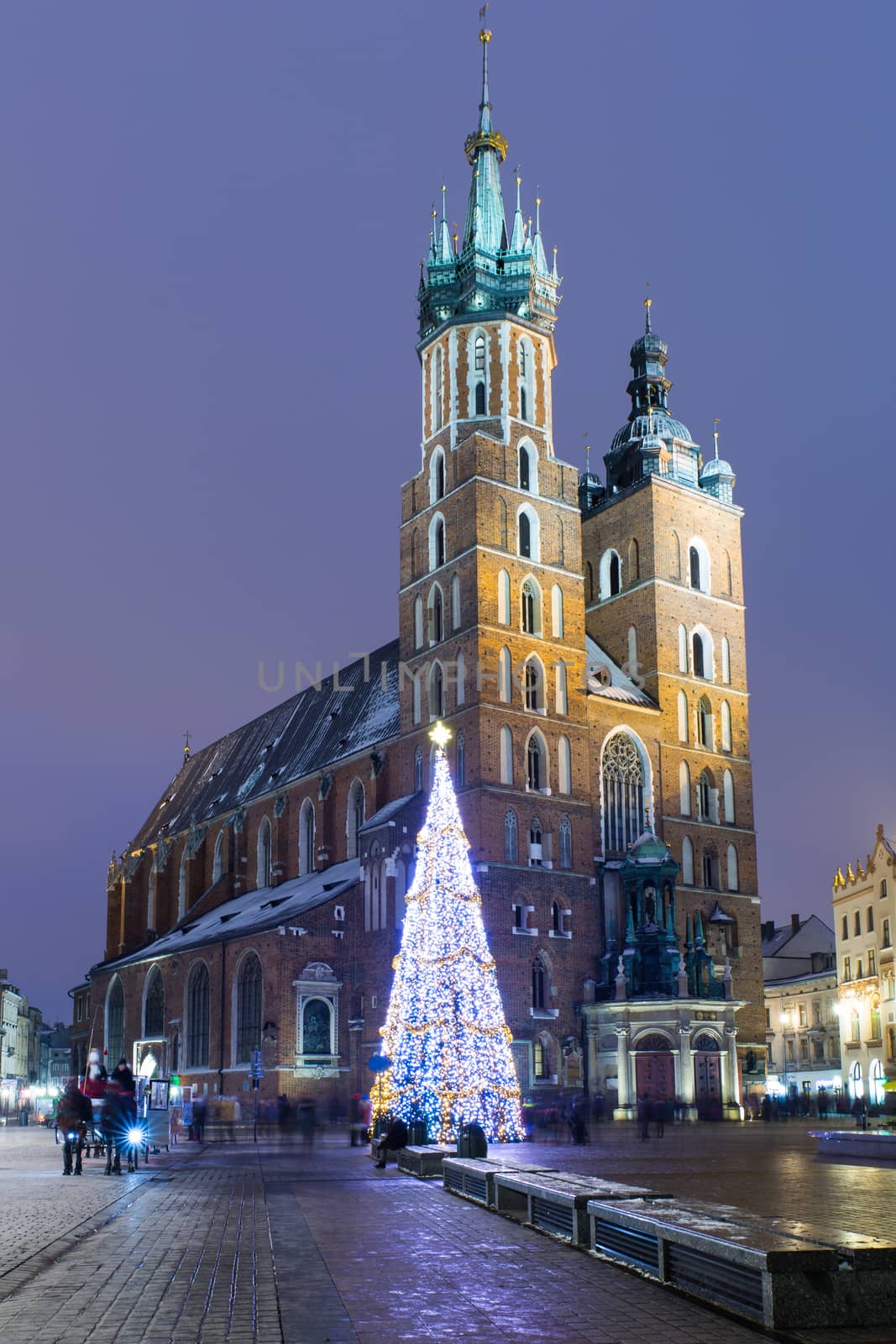 The St. Mary's basilica in Krakow, Poland at night during Christmas time.