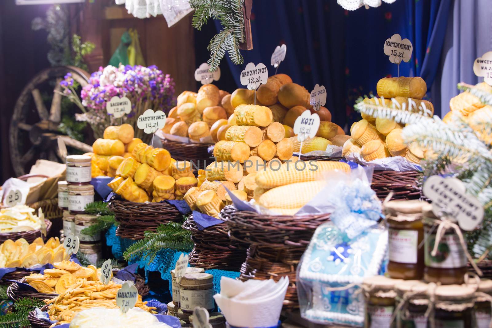 Traditional Polish smoked cheese (Oscypek) on a Christmas market stall in Krakow, Poland.