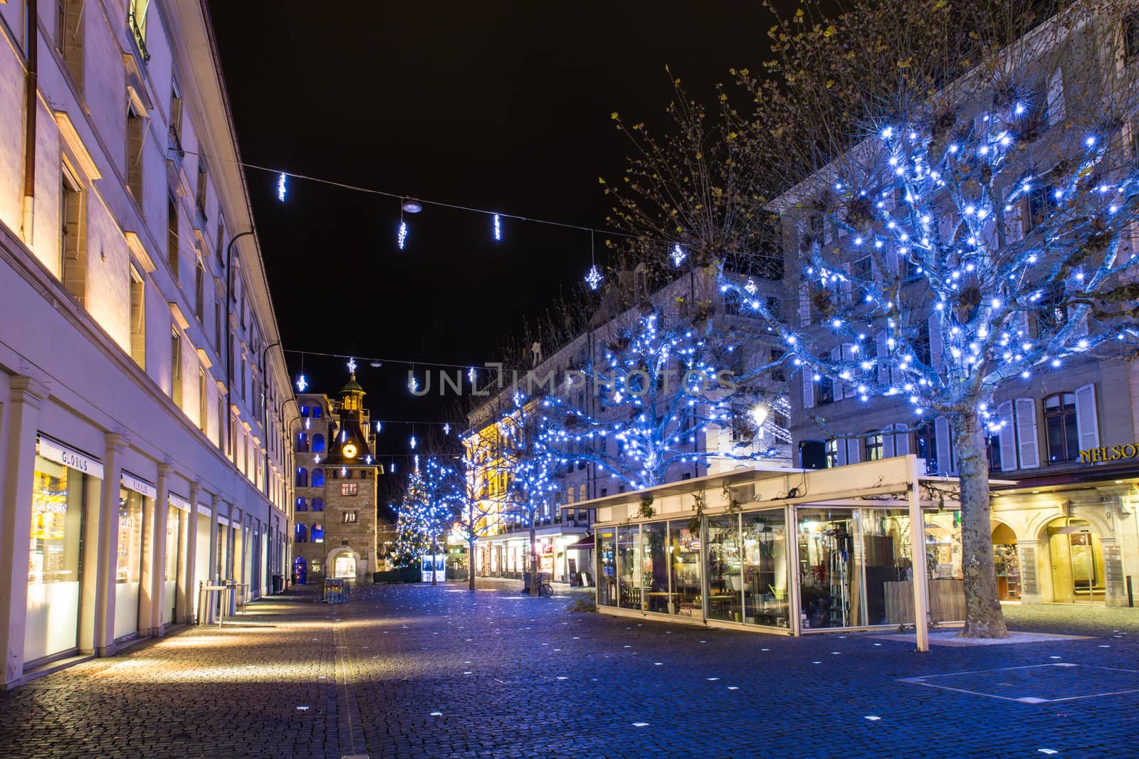 Geneva, Switzerland - December 13, 2014: The Molard square at night illuminated by Christmas decorations, in downtown Geneva.