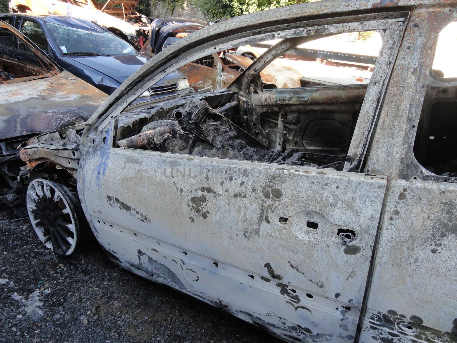 Poissy, France - October 11 2010: Burned French Sport Car Parked outside a Garage. Stolen and Burned Renault Megane RS