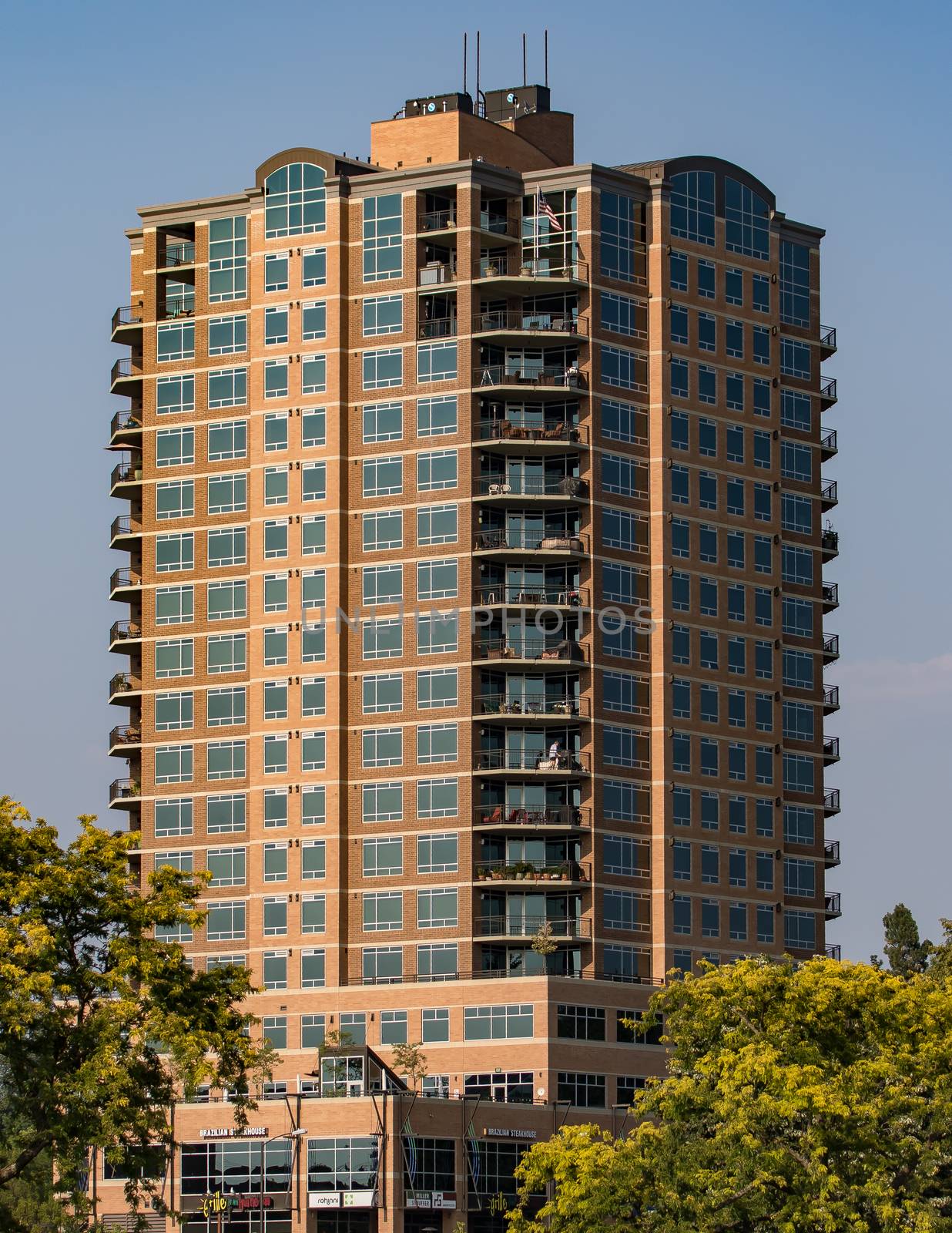 Coeur d'Alene, Idaho, USA-July 9, 2015: A view of a large apartment building and offices in Idaho from LakeCoeur d'Alene during sunset.