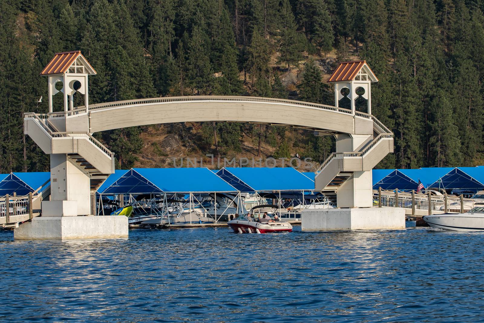 Coeur d'Alene, Idaho, USA-July 9, 2015: A tour boat from the Coeur d'Alene Resort returns back to the marina after a sunset cruise on the lake.