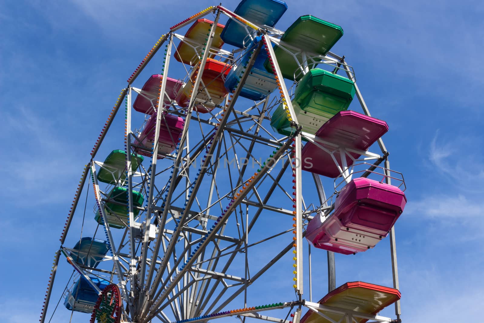 A colourful ferris wheel. Front view