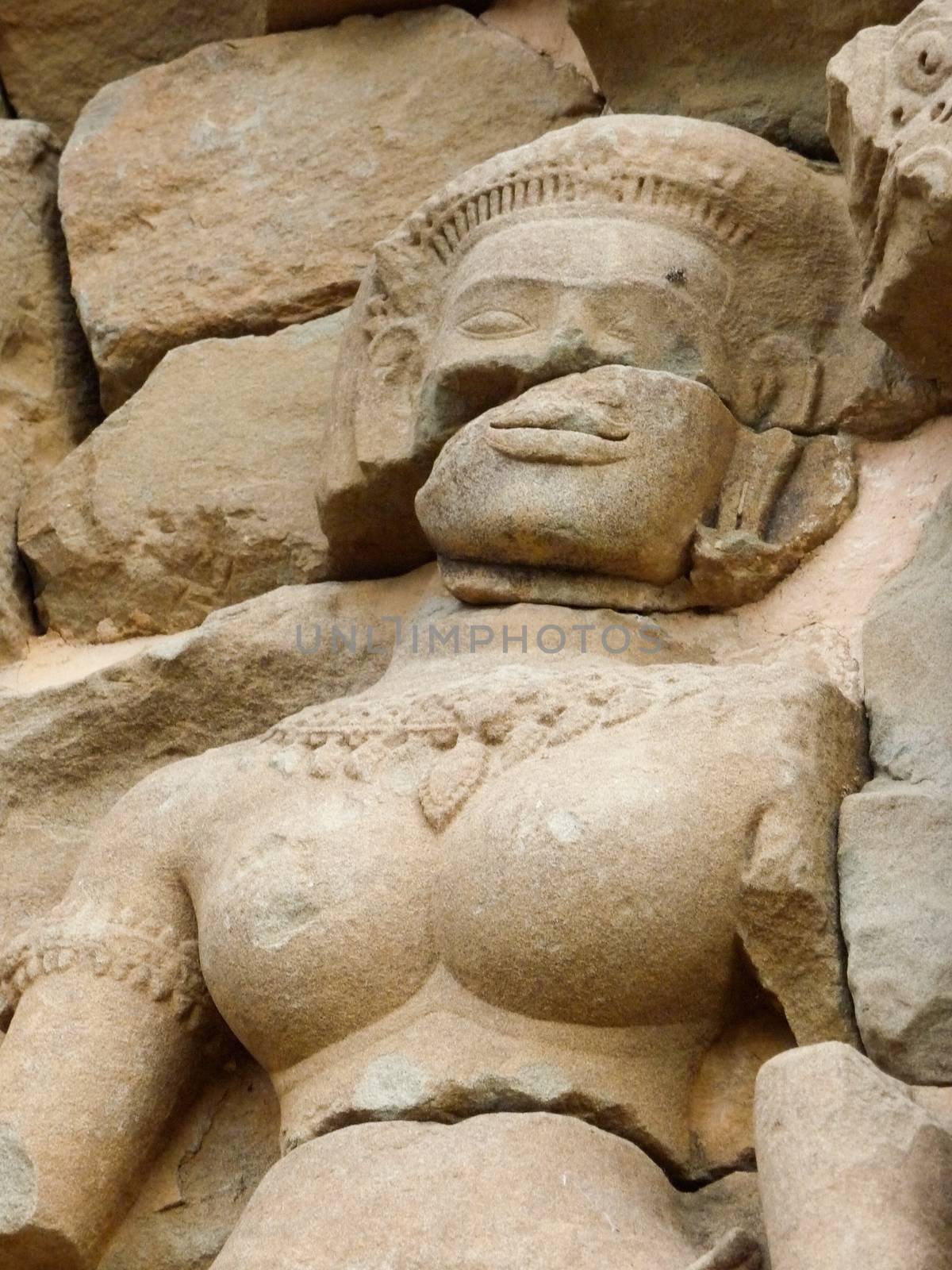 Bas-Relief at Ta Phrom temple showing a broken Apsara