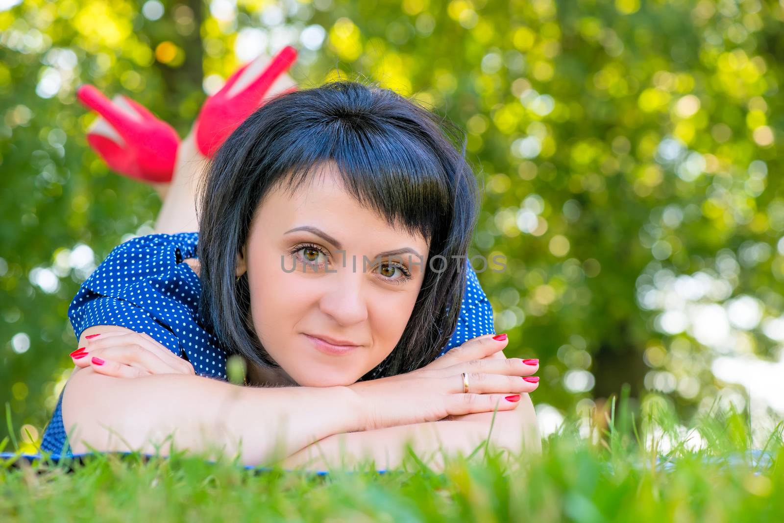 portrait of a girl with black hair lying on the lawn by kosmsos111