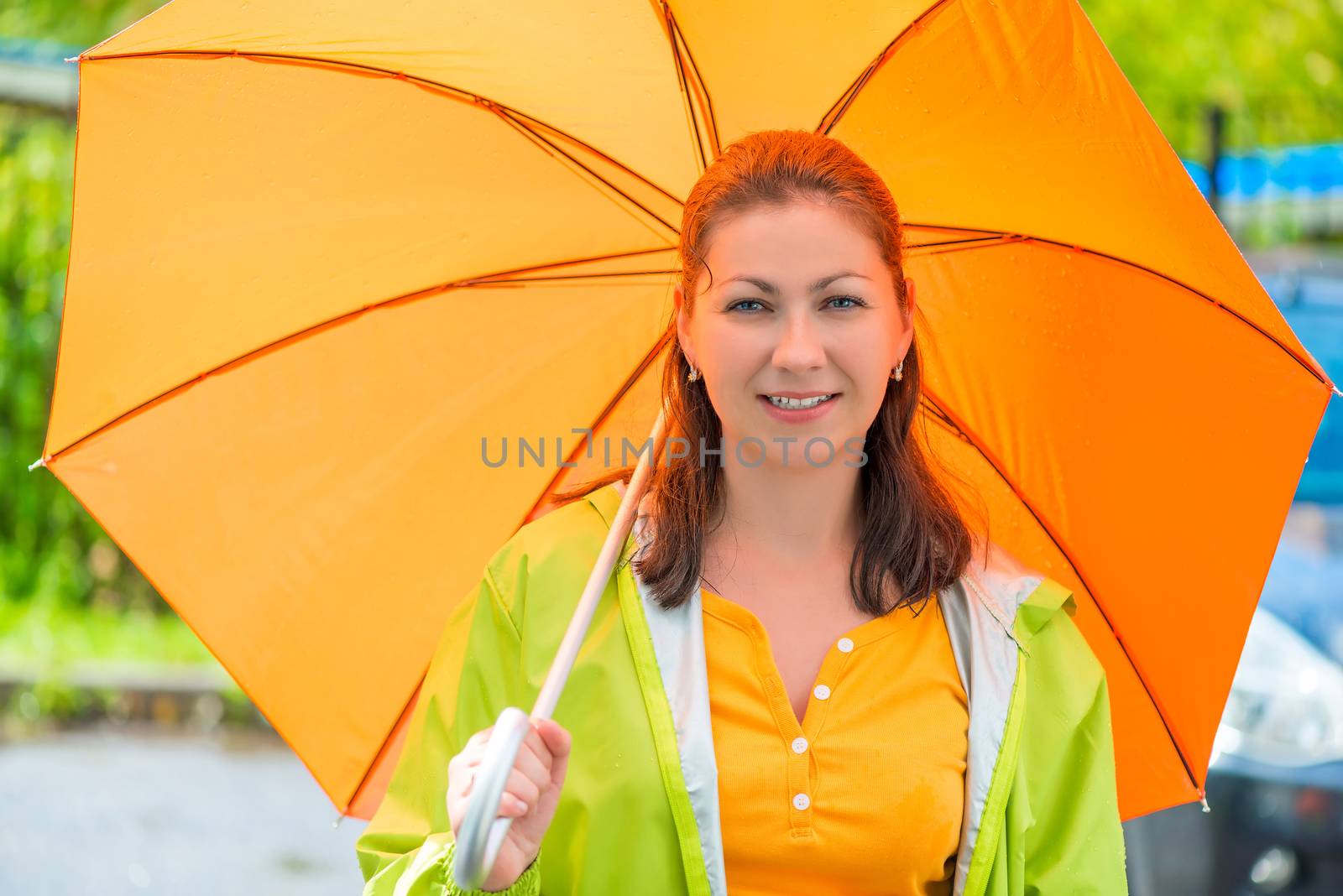 Portrait of a young brunette with an orange umbrella closeup by kosmsos111