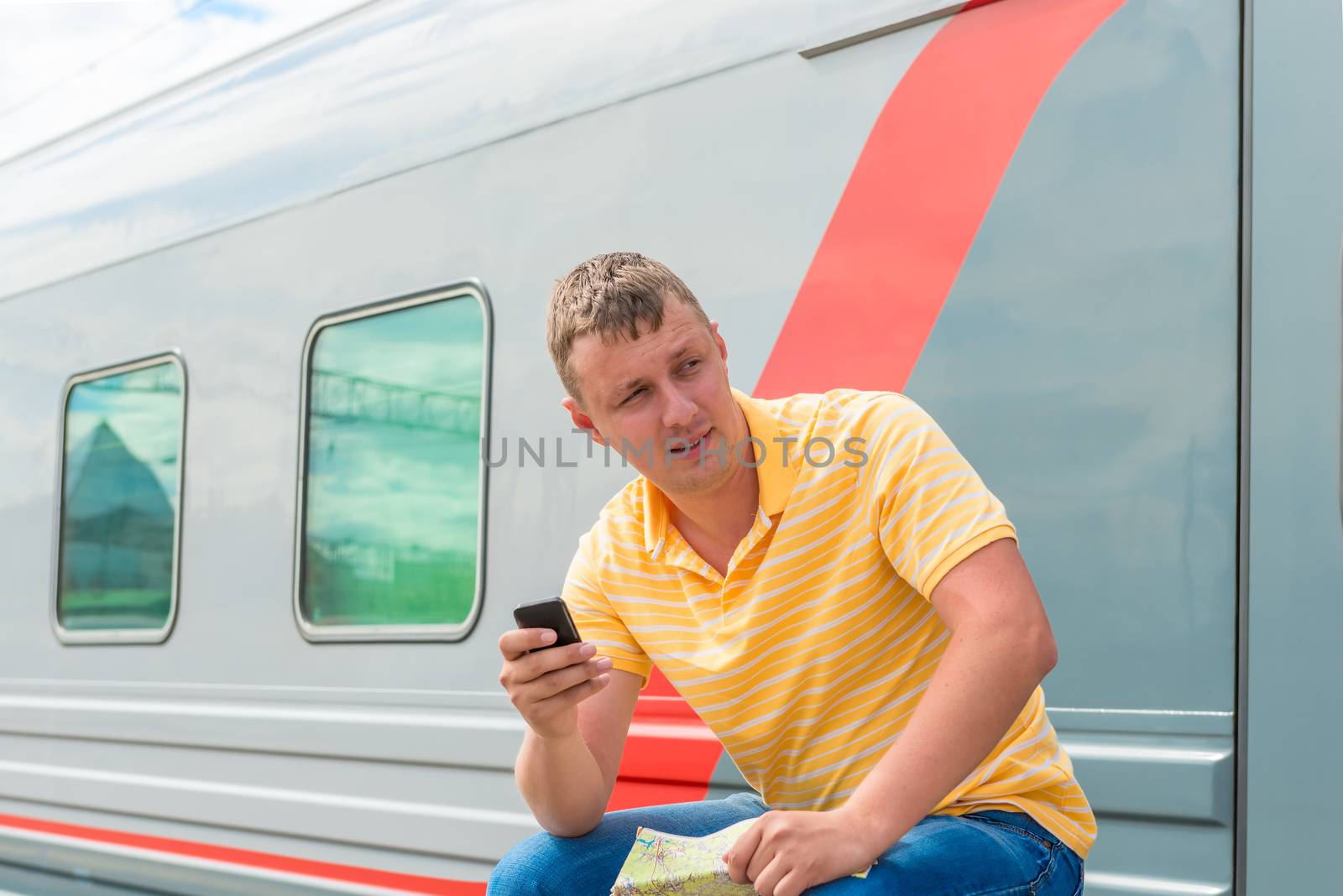 portrait of a man with the phone near long-distance trains by kosmsos111