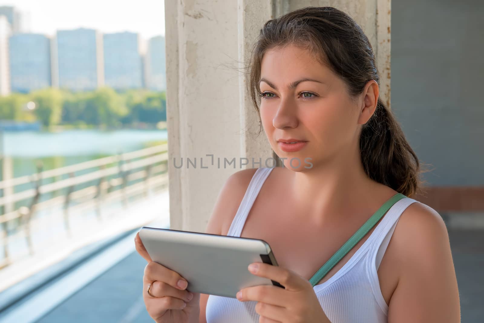 beautiful woman with a tablet in urban locations by kosmsos111