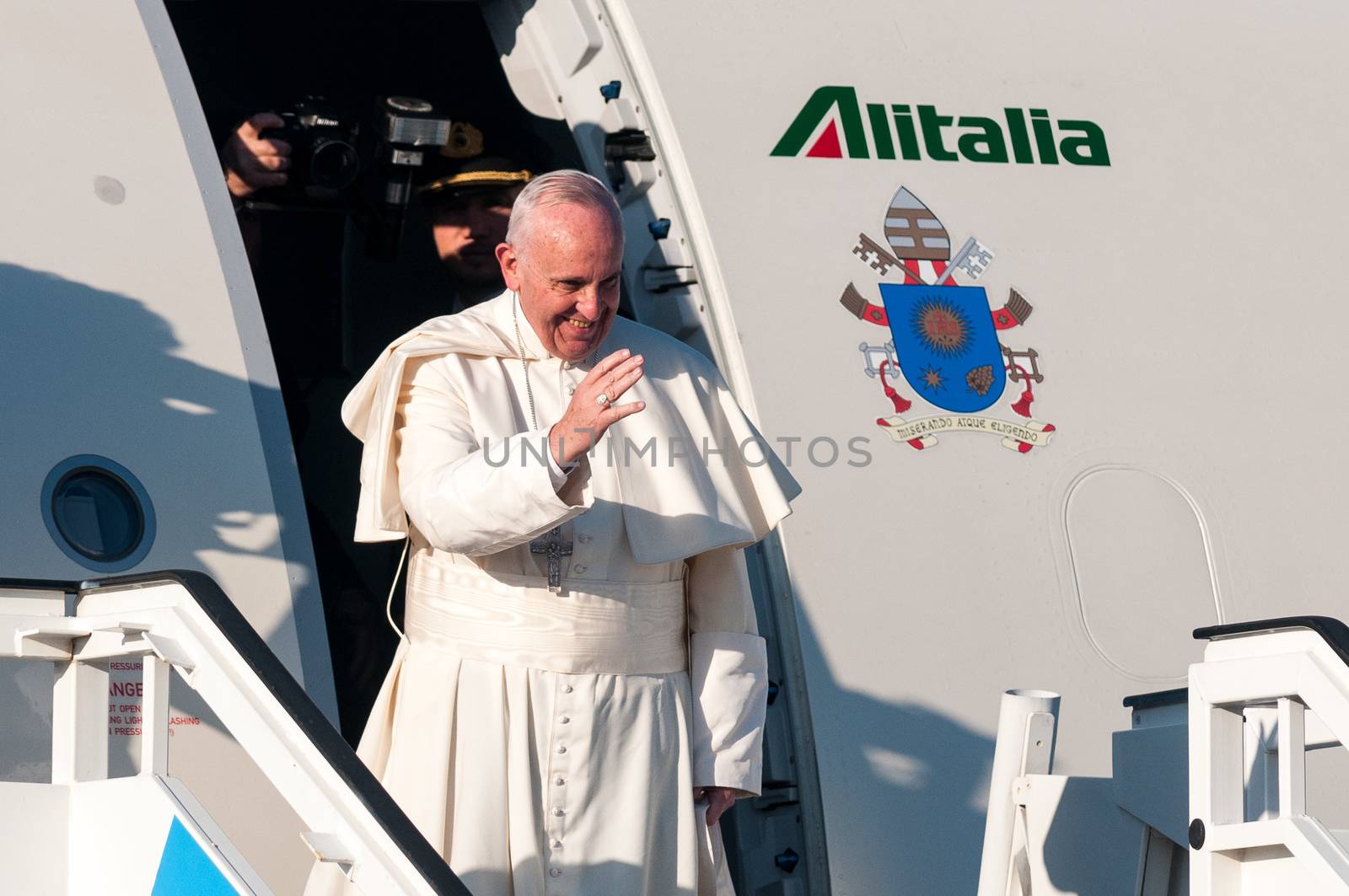 CUBA, Havana: Pope Francis waves from his plane at Jose Marti International Airport in Havana as he leaves for Mexico on February 12, 2016. Pope Francis and Russian Orthodox Patriarch Kirill kissed each other and sat down together Friday at Havana airport for the first meeting between their two branches of the church in nearly a thousand years.