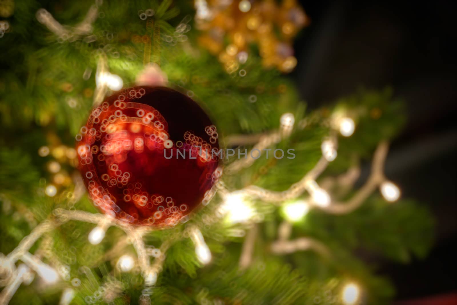 Gold Christmas background of de-focused lights with decorated tree, Christmas background 