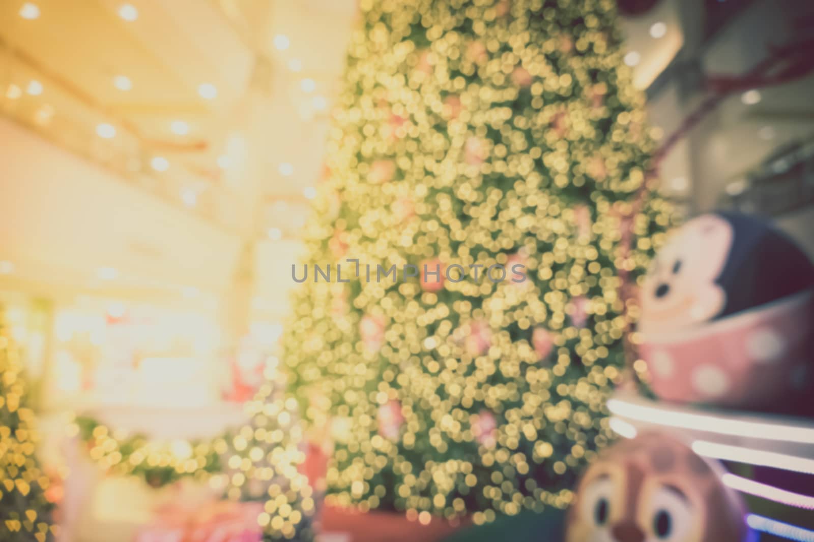 Gold Christmas background of de-focused lights with decorated tree, Christmas background 