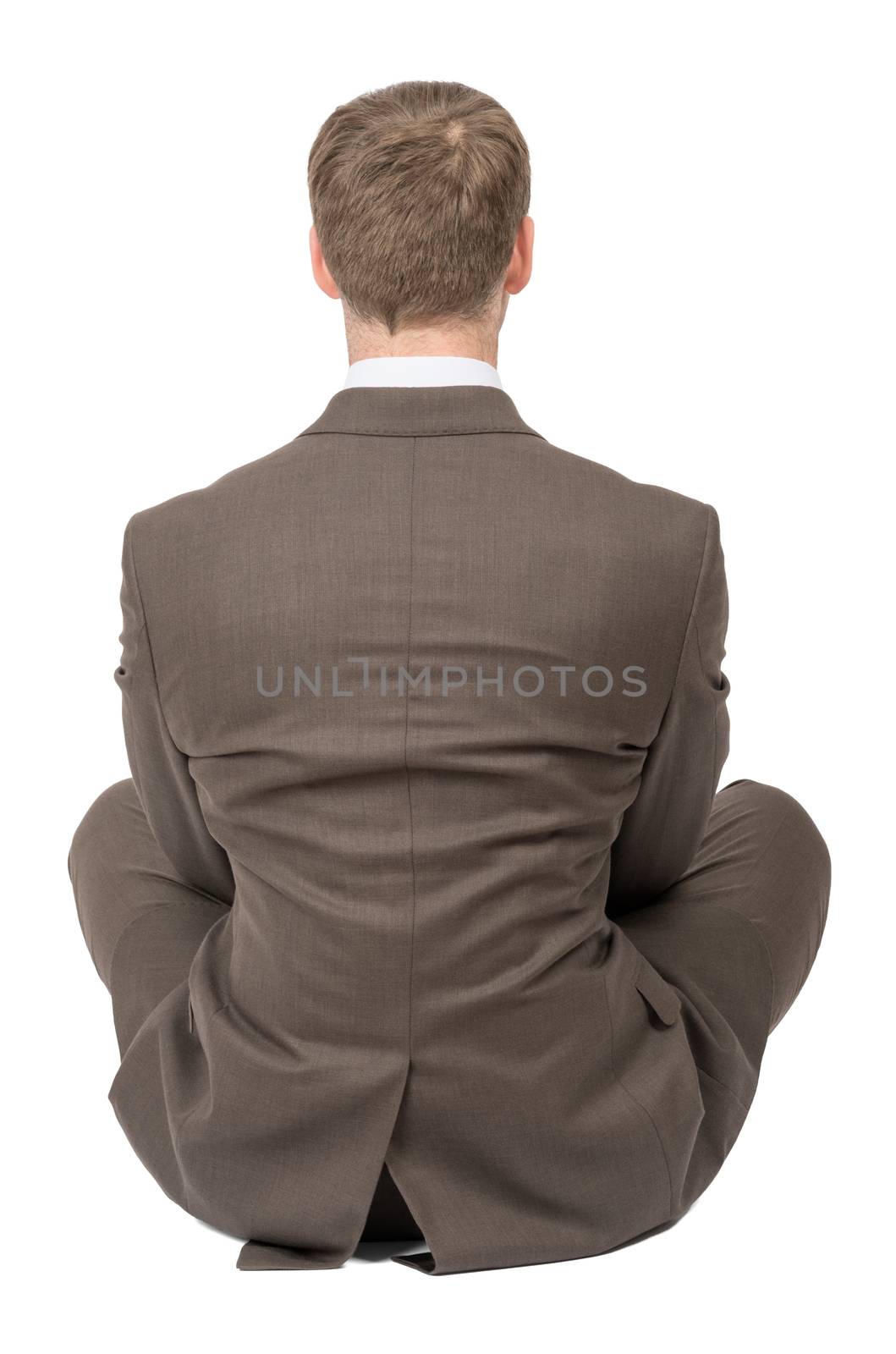 Businessman in lotus posture, rear view by cherezoff
