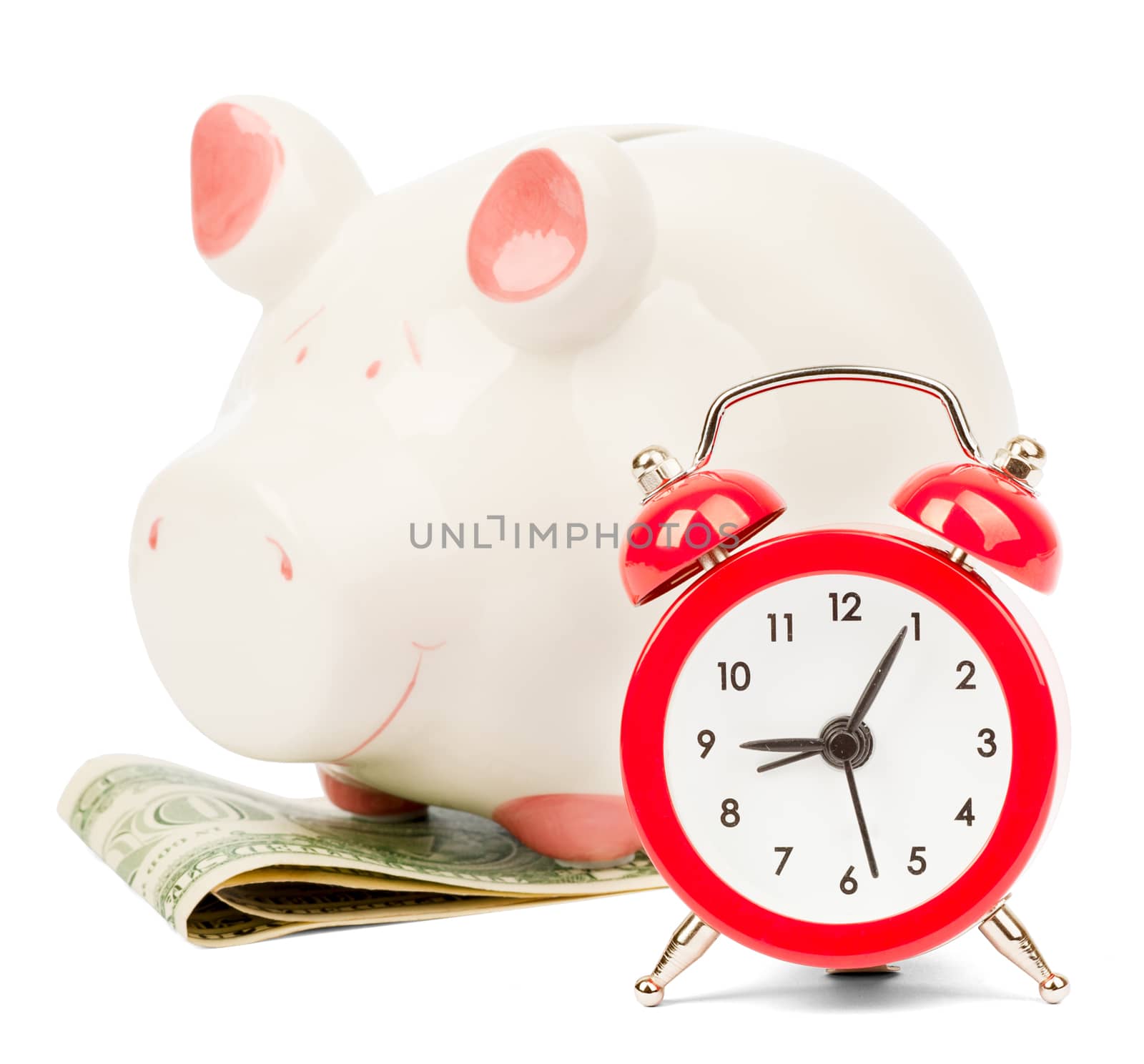 Piggy bank with dollars and alarm clock on isolated white background