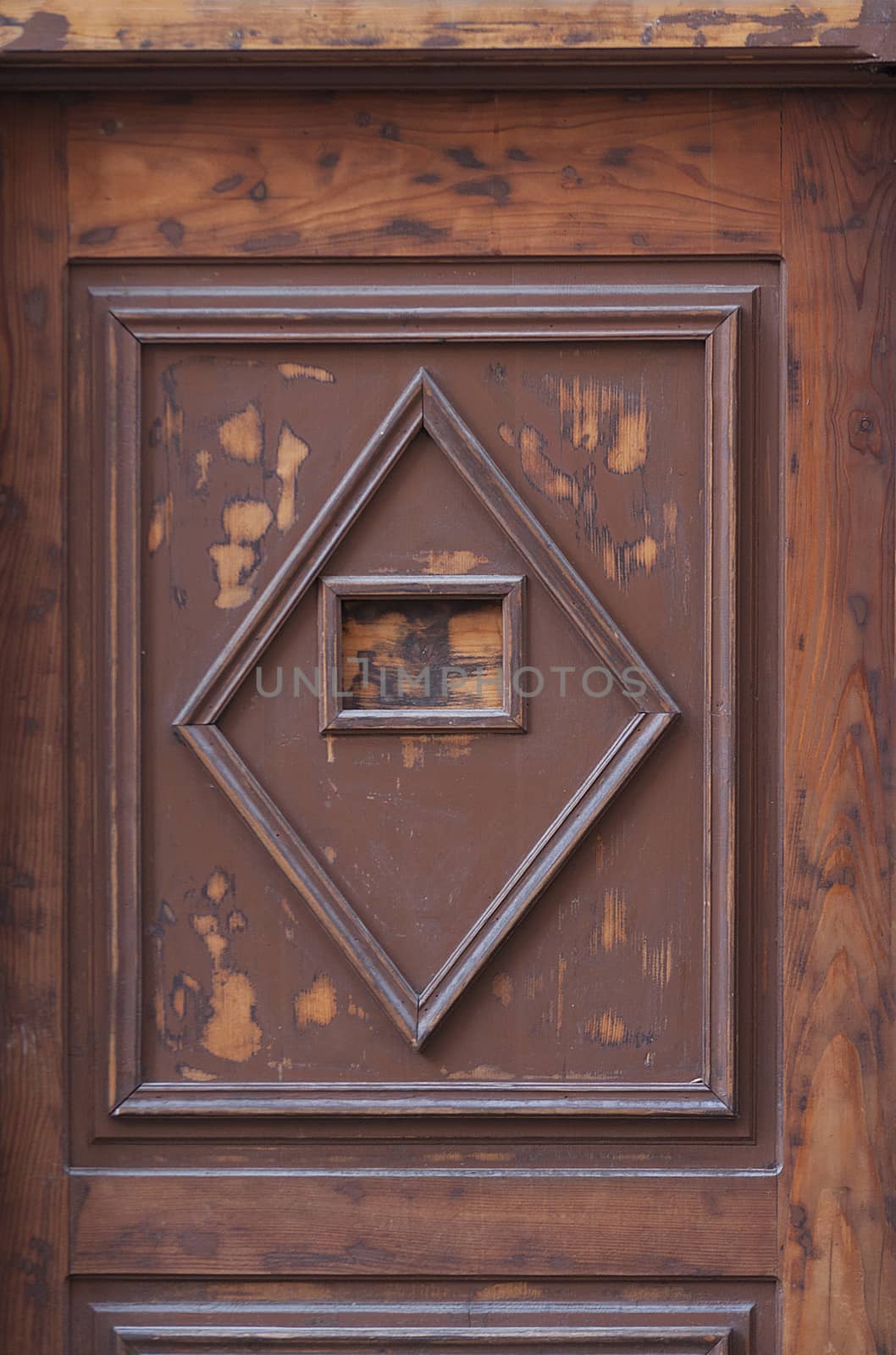 Detail of a wooden door with square and diamond pattern