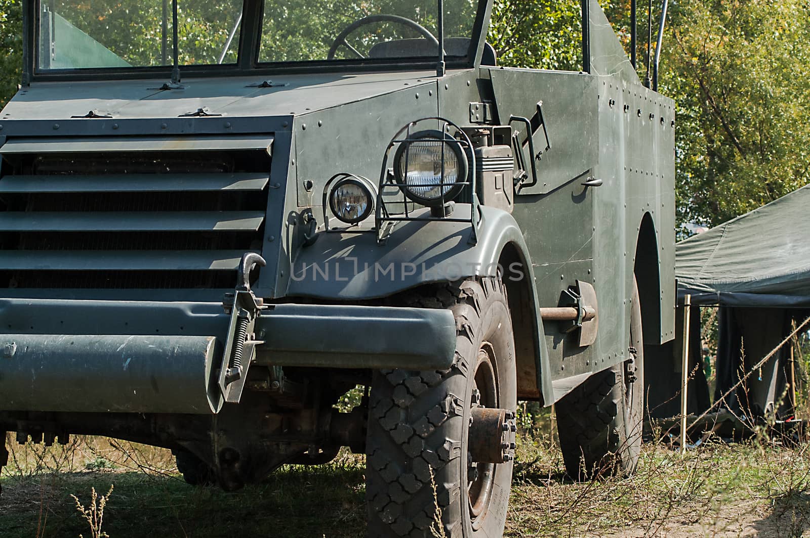 Gray and olive vintage military truck on the road