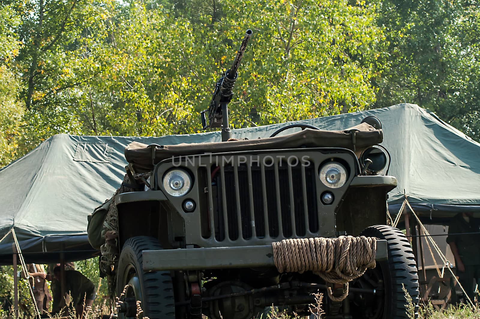 Gray and olive vintage military truck on the road