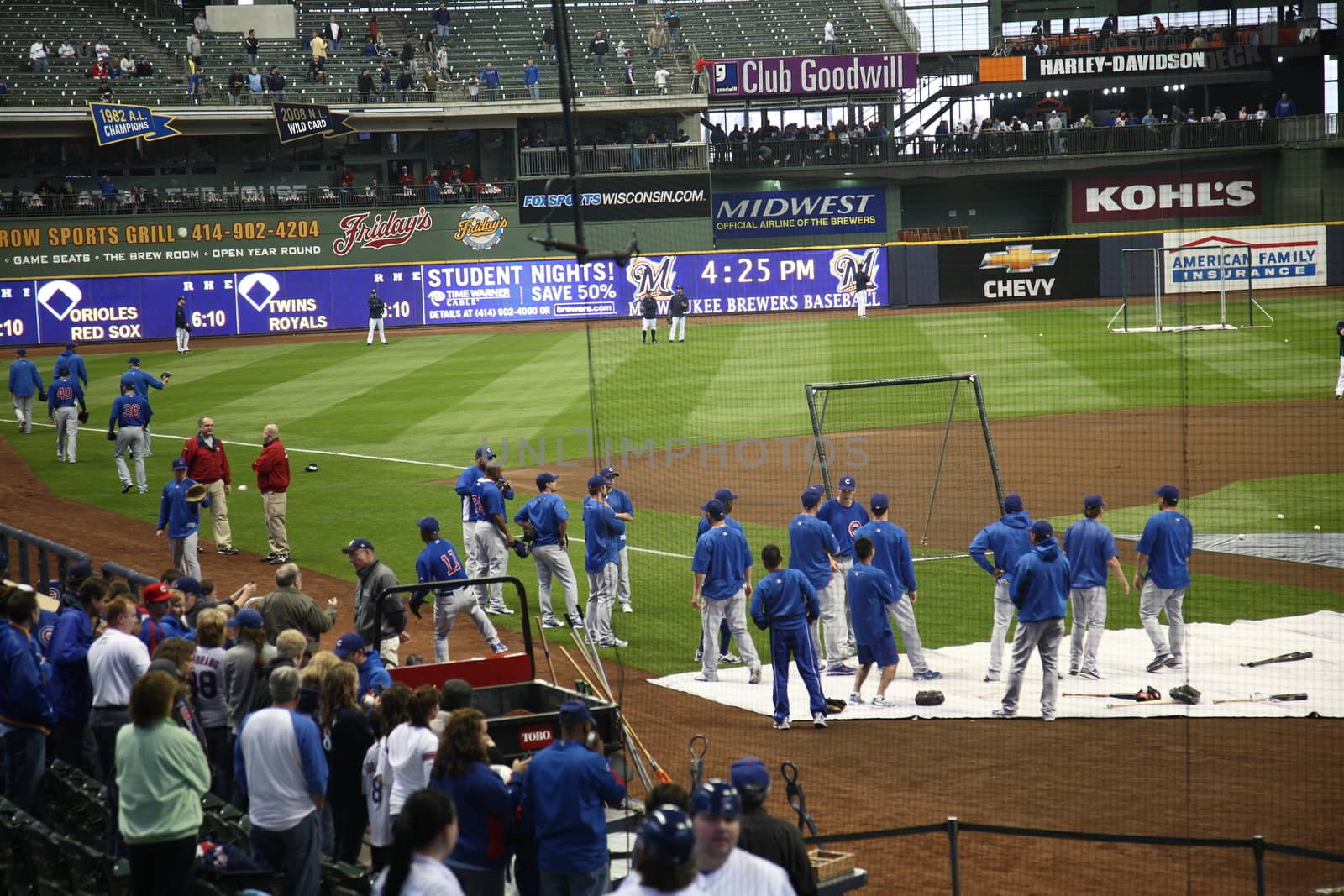 Milwaukee Brewers fans await a baseball game at Miller Park against the Chicago Cubs under a closed dome.