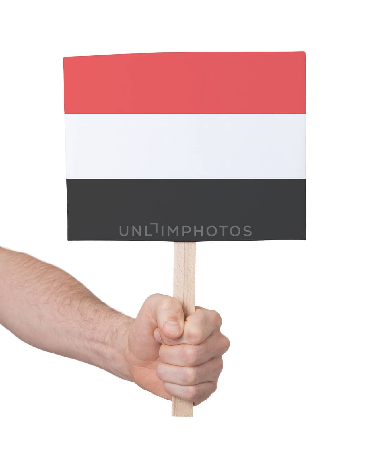 Hand holding small card, isolated on white - Flag of Yemen