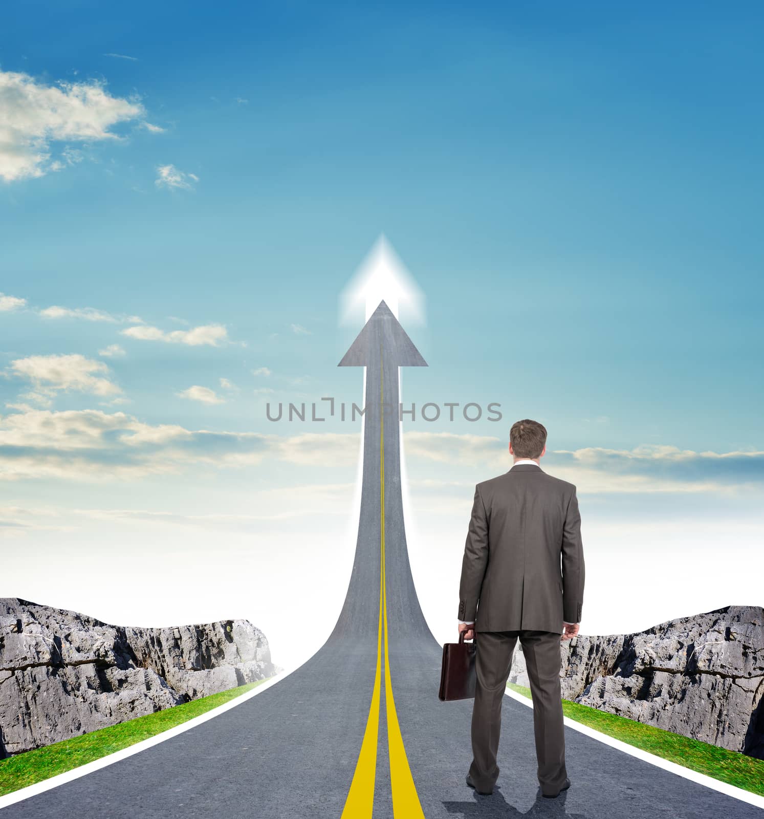 Businessman standing on highway road going up as an arrow in sky