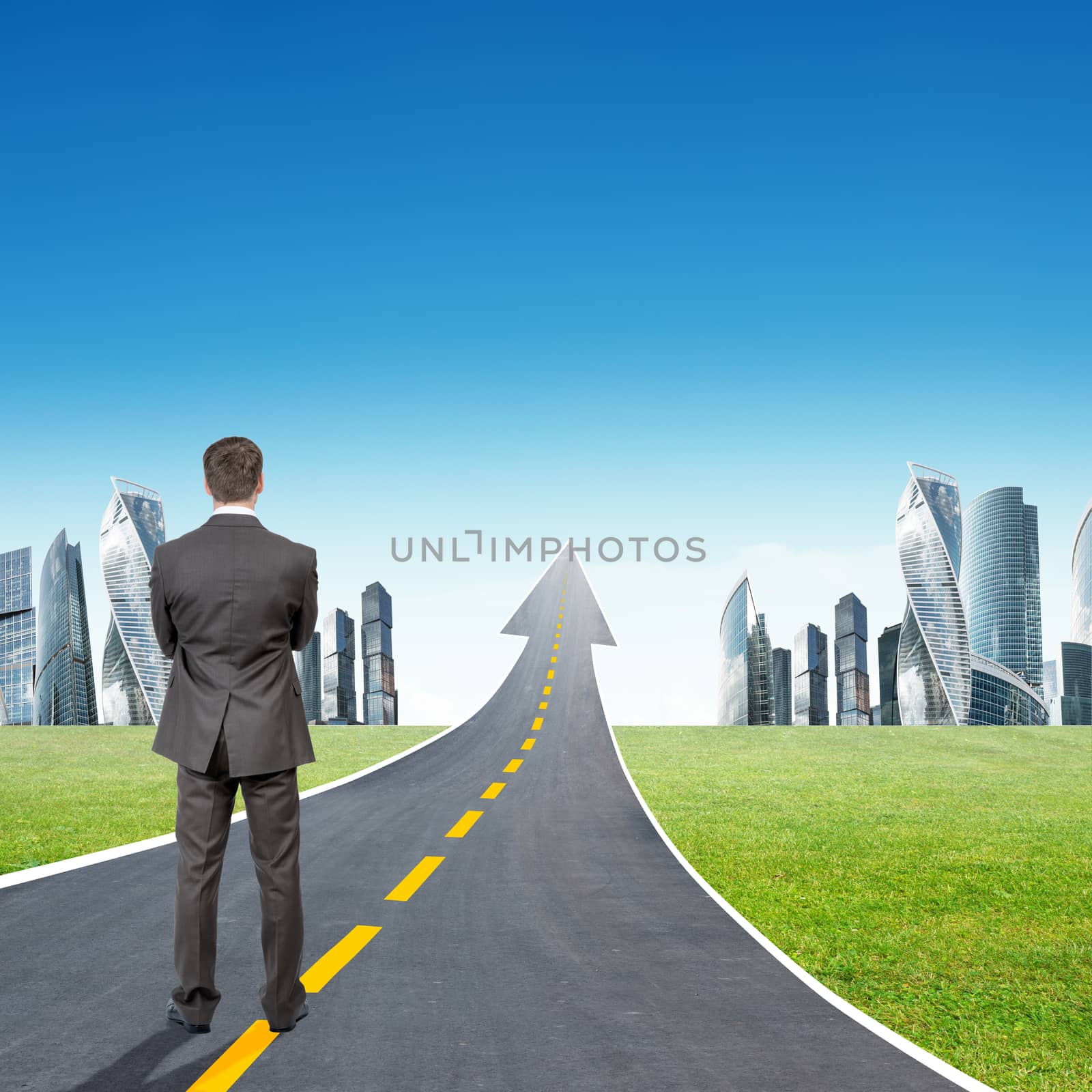 Businessman standing on highway going up as arrow by cherezoff