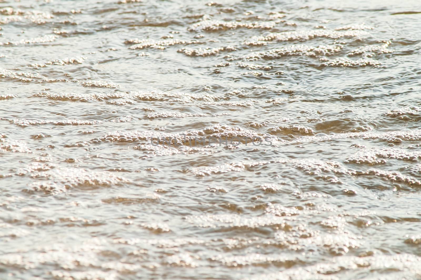 surf on a sandy beach with waves by antonius_