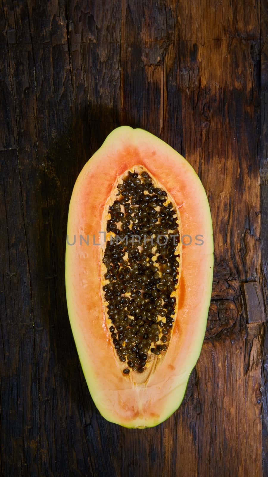 top view sliced fresh papaya on old wooden table