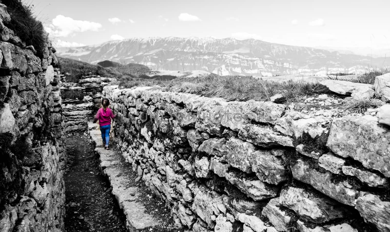 Trench dug in the rock dating back to World War I located on the Italian alps.